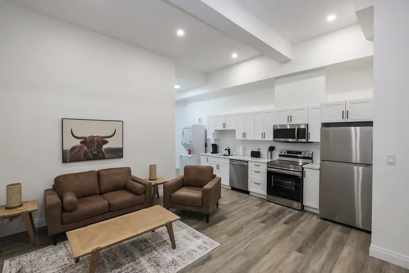 Furnished living room and kitchen at Gateway Suites
