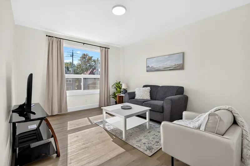 Furnished living room at McEwan Suites