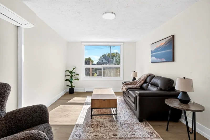 Furnished living room at McEwan Suites